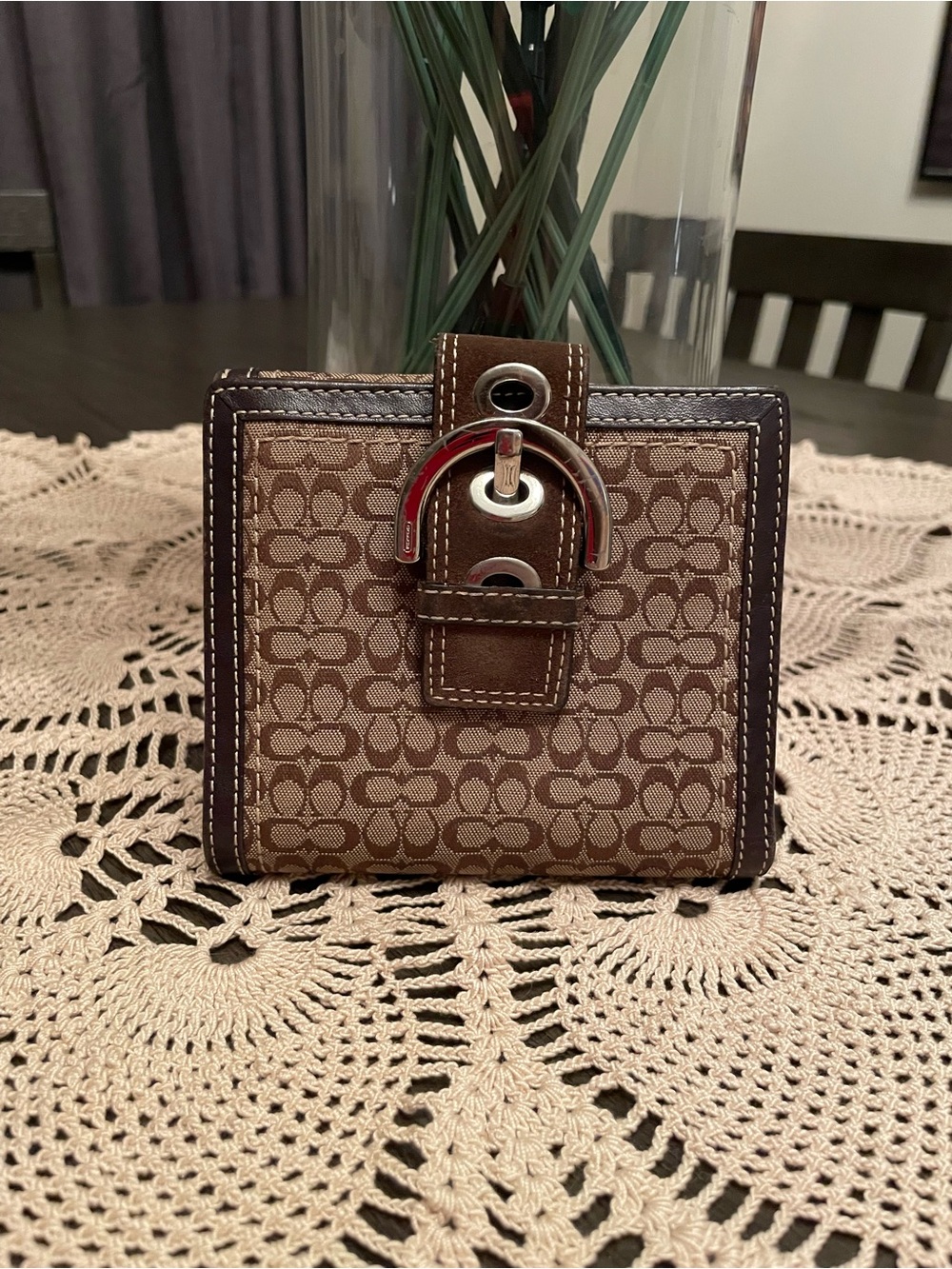 Coach Signature Soho Buckle bifold wallet in brown and tan monogram canvas
